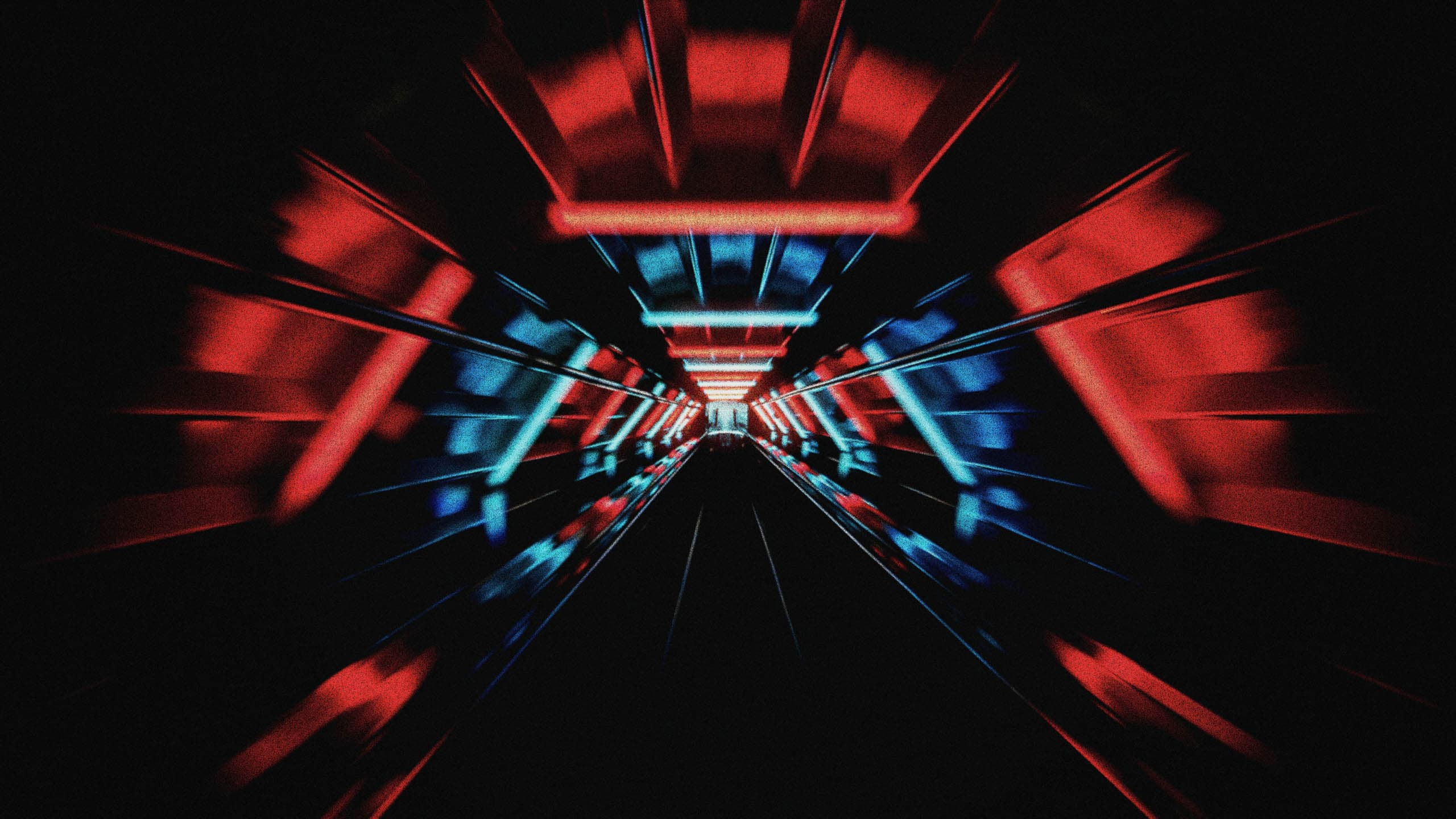 A tunnel of red and blue light streaks